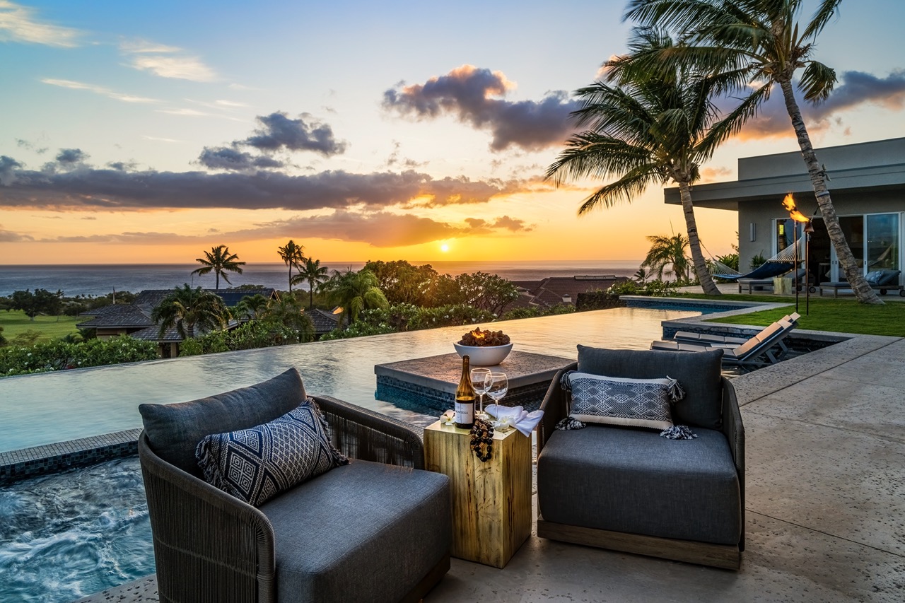 Infinity pool and hot tub at sunset