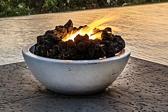Pool and fire pit at twilight — blue LED pool under deep Hawaiian sky