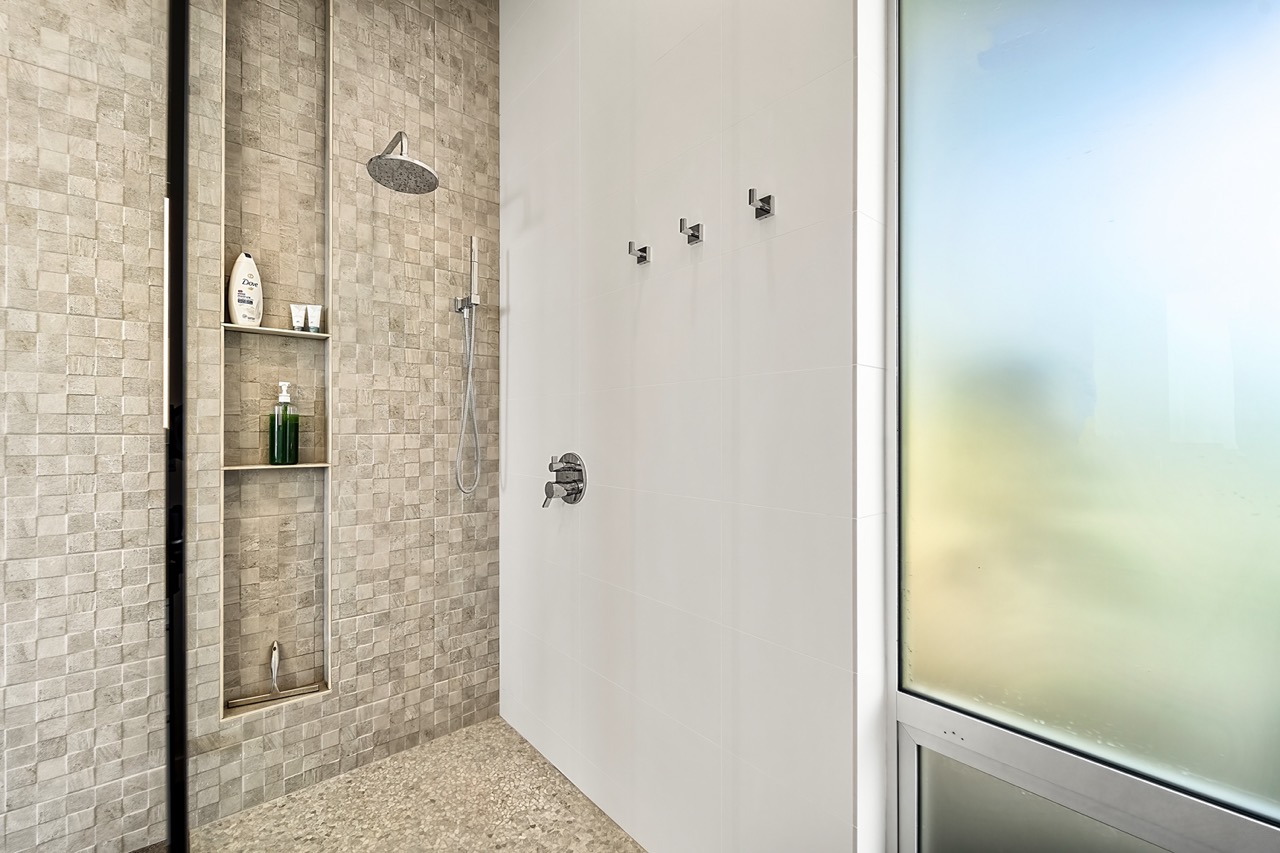 Lave Suite walk-in shower with mosaic tile
