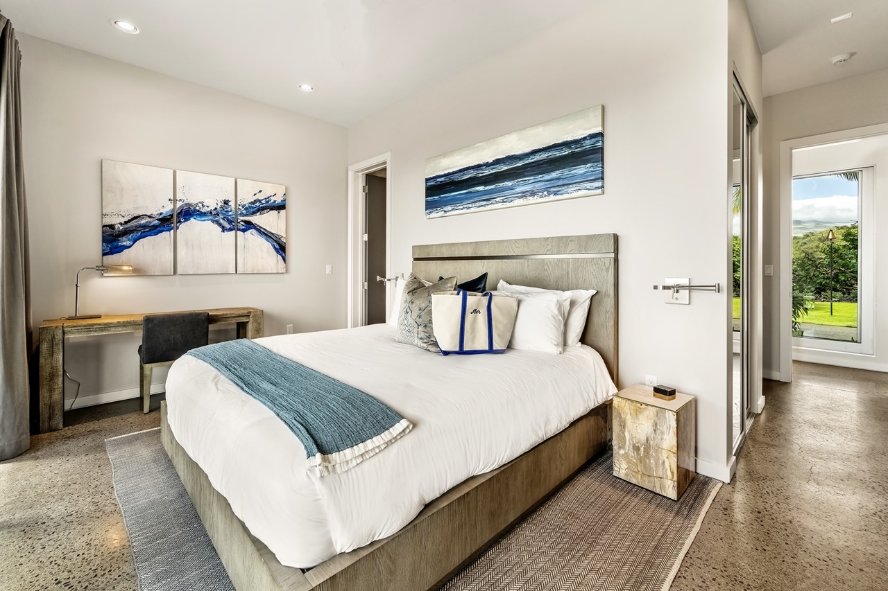 Mer Suite — ocean-themed king bedroom with private lanai
