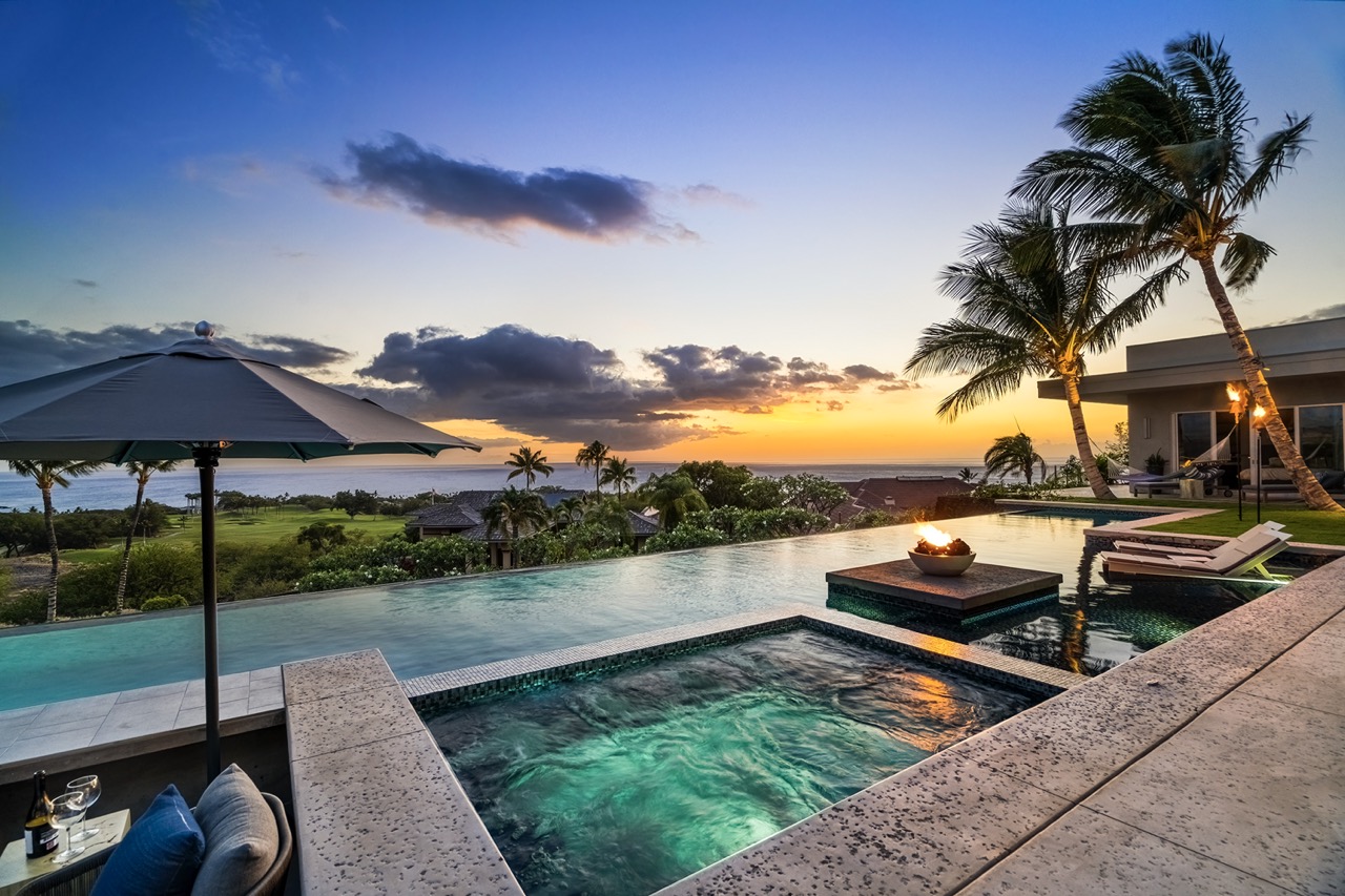Hot tub, pool, fire bowl and sunset over golf and ocean